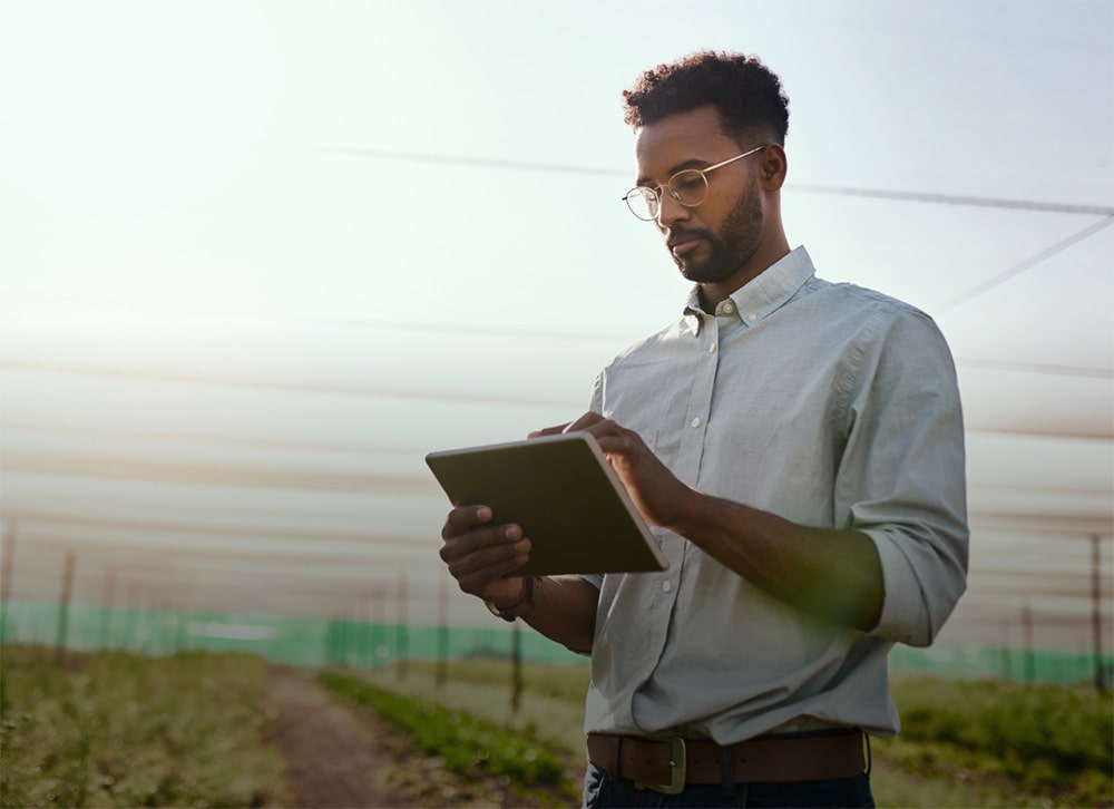 Agricultural worker on tablet
